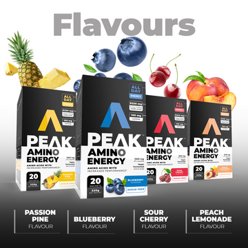 Peak Amino Energy supplement packages with fruit illustrations and flavor names below.