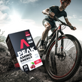 Person riding a bicycle with a Peak Amino Energy supplement box in the foreground