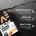 Peak Amino Energy supplement package with mixing instructions on a dark stone background