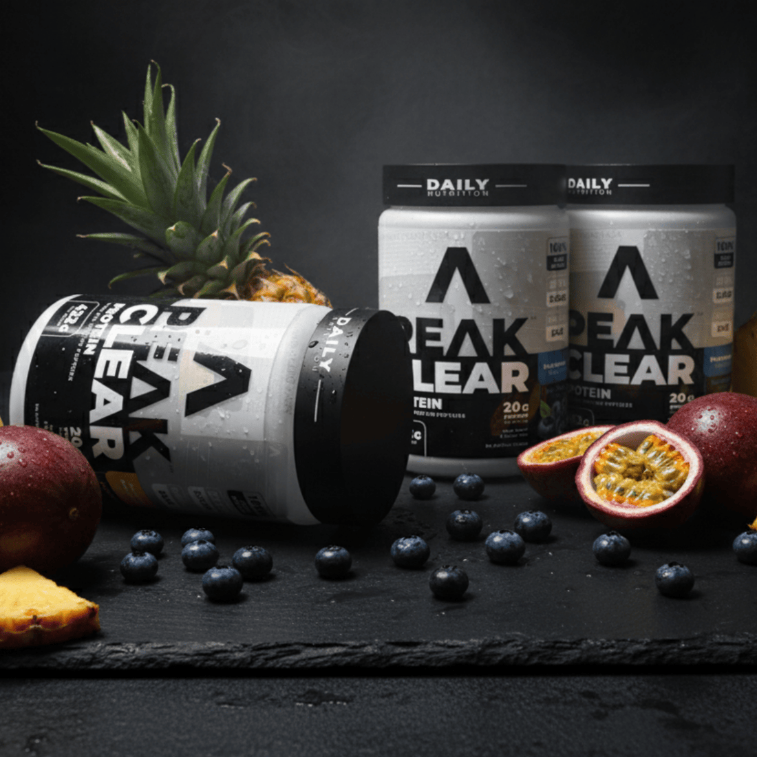 Peak Clear Protein container with black and white label blueberry flavour