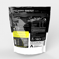 Black and white supplement package with Daily Nutrition branding on a light gray background