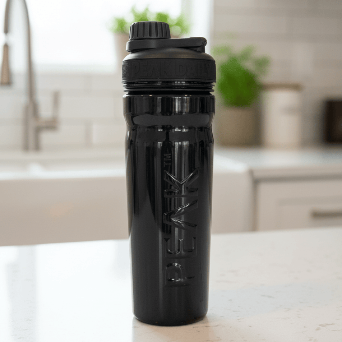 Black water bottle with a logo on a white background